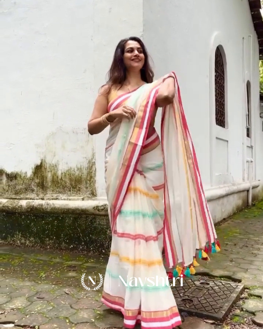 Image00001 Pratham Jyot - Pure White Linen Saree with Vibrant Multicolor Stripe Border & Blouse Piece - Image 1
